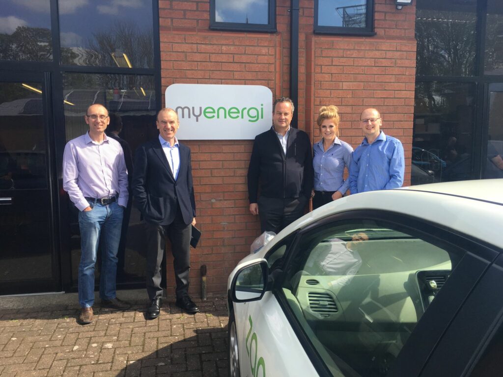 Jordan Brompton and Lee Sutton with Sir Terry Leahy and Bill Currie in front of our old office - Our Founders Story, becoming a renewable energy tech firm