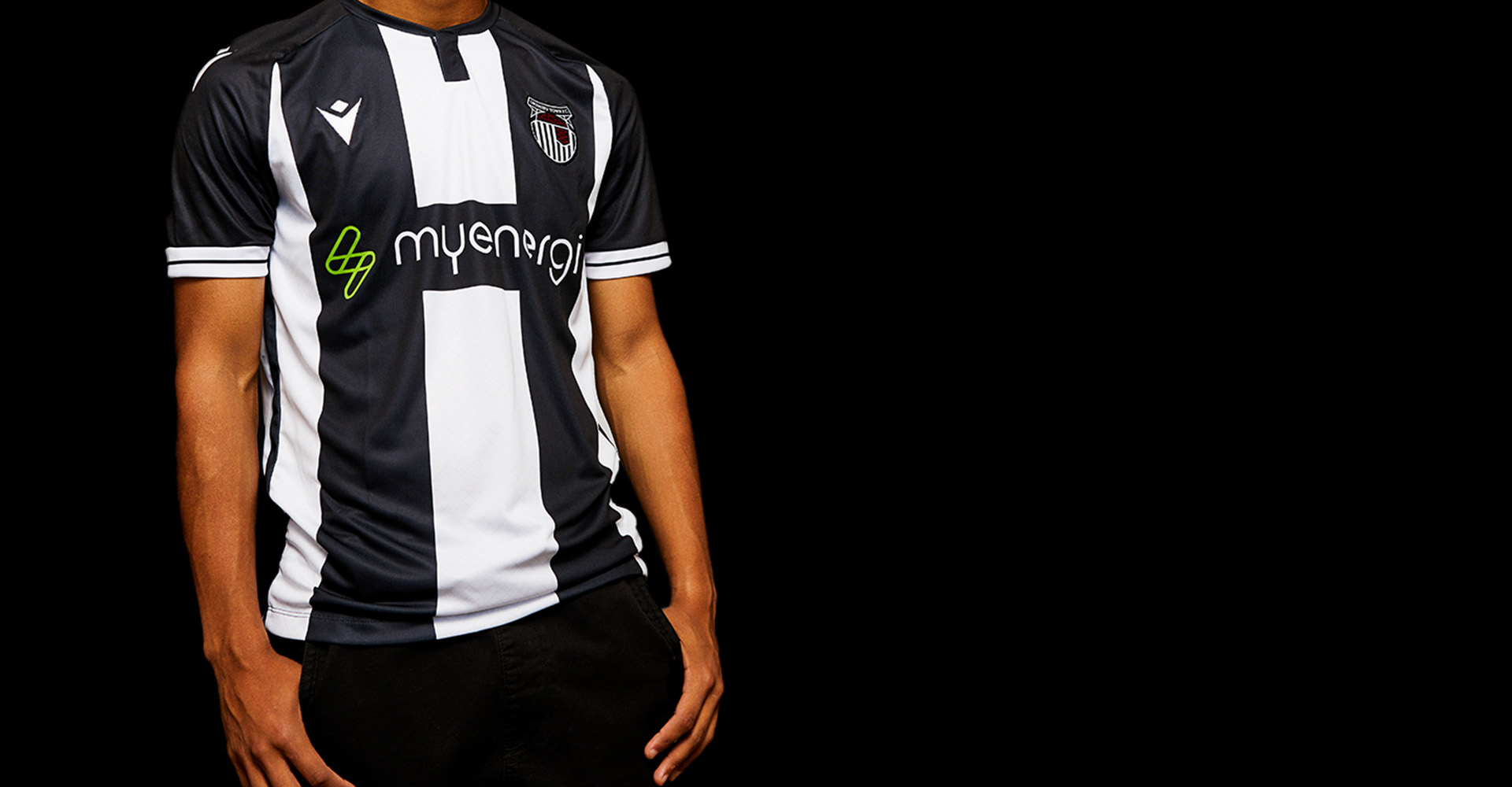 A cropped photo of a player wearing the 23/24 Grimsby Town Football Club Home Shirt